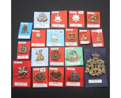 A COLLECTION OF NINETEEN BADGES FOR THE SUFFOLK, NORFOLK, ESSEX AND SIMILAR REGIMENTS. A collection of badges for the Essex, 