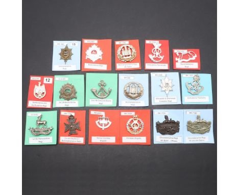 A COLLECTION OF SEVENTEEN BADGES FOR THE OXFORD AND BUCKS AND SIMILAR COUNTY REGIMENTS. A collection of badges for various Re