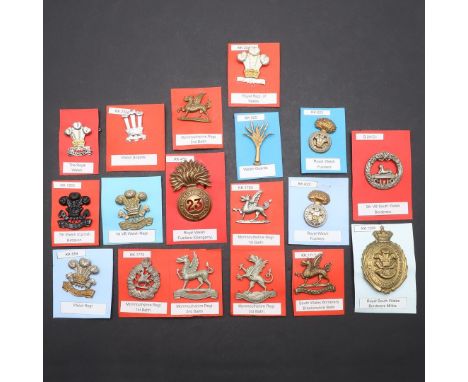 A COLLECTION OF EIGHTEEN BADGES FOR WELSH REGIMENTS. A collection of badges including examples for the Royal Welsh Fusiliers,