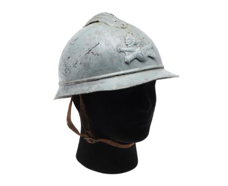 A FIRST WORLD WAR M16 PATTERN ADRIAN HELMET. An M16 pattern helmet, the helmet plate with RF on a flaming grenade against cro