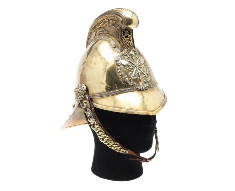 A LATE 19TH OR EARLY 20TH CENTURY BRASS MERRYWEATHER FIRE BRIGADE HELMET. With a raised comb decorated with a fire-breathing 