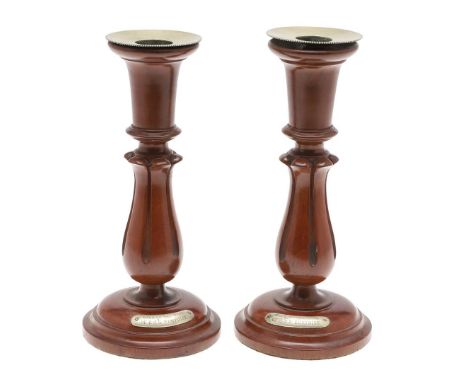 A FINE PAIR OF WALNUT CANDLESTICKS MADE FROM WOOD FROM H.M.S. EURYDICE. A pair of candlesticks with broad plated sconces on t