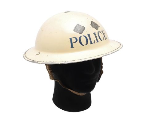 A SECOND WORLD WAR MKII POLICE INSPECTOR'S STEEL HELMET. A Home Front Police Inspector's helmet painted cream with 'POLICE' t