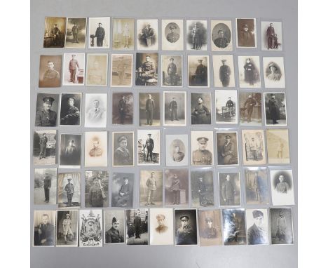 A COLLECTION OF SIXTY POSTCARDS OF FIRST WORLD WAR AND LATER SOLDIERS IN UNIFORM. An interesting collection of sixty postcard