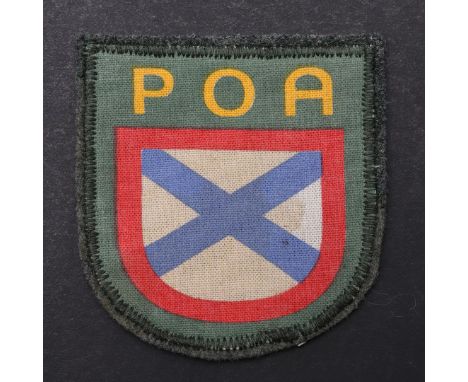 A SECOND WORLD WAR POA OFFICER'S ARM BADGE. A POA patch with blue cross against a white ground beneath POA in yellow. Used by