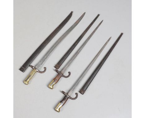 A CHASSEPOT AND TWO GRAS BAYONETS AND SCABBARDS. An M1866 Chassepot bayonet and scabbard, both numbered 360 and dated 1872 to
