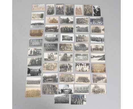 A COLLECTION OF FIFTY POSTCARDS OF FIRST WORLD WAR AND LATER GROUPS OF SOLDIERS IN UNIFORM. An interesting collection of fift