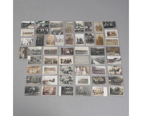 A COLLECTION OF FIFTY POSTCARDS OF FIRST WORLD WAR AND LATER GROUPS OF SOLDIERS IN UNIFORM. An interesting collection of fift