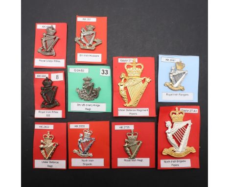 A COLLECTION OF TEN BADGES FOR IRISH REGIMENTS. A collection of badges including examples for the Ulster Defence Regiment, Ro