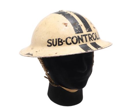 A SECOND WORLD WAR MKII SUB CONTROLLERS STEEL HELMET DATED 1939. A Home Front Warden's helmet with a double black stripe and 