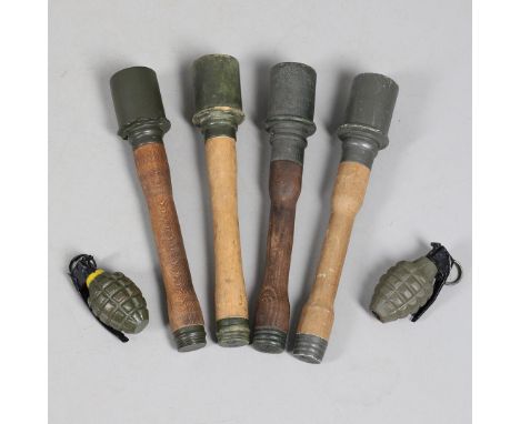 A COLLECTION OF AMERICAN AND GERMAN REPRODUCTION HAND GRENADES. Four Second World War German stick grenades and two American 