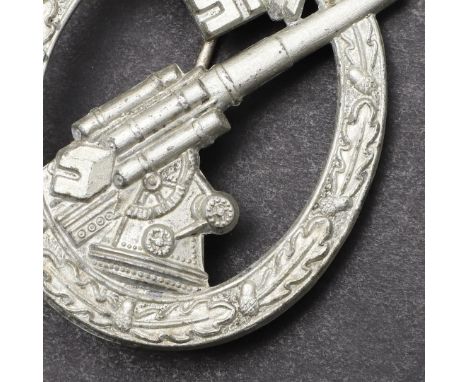 A SECOND WORLD WAR GERMAN ARMY FLAK BADGE. A Flak badge with flak gun pointing to the sky within a wreath and beneath an eagl