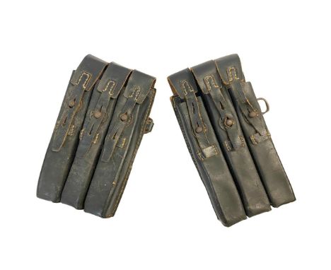 TWO BLACK LEATHER GERMAN MAGAZINE POUCHES. Two German Second World War black leather Ammunition Pouches, probably for a subma