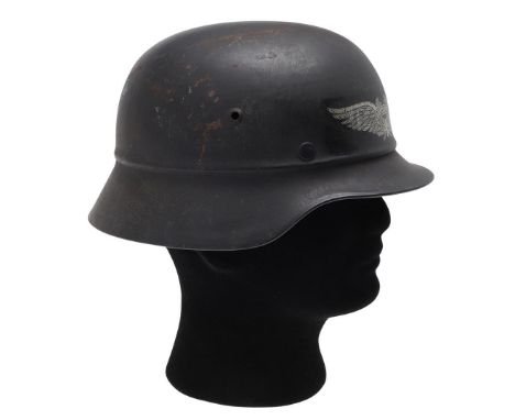 A SECOND WORLD WAR GERMAN LUFTSCHUTZ HELMET. An M40 pattern Luftschutz (Air Defence) gladiator pattern steel helmet, with lea