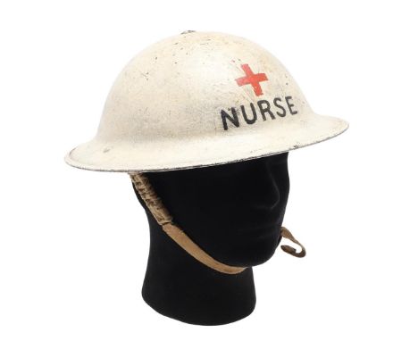 A SECOND WORLD WAR MK II STEEL NURSE'S RED CROSS HELMET. A steel helmet painted cream with a red cross to the front above 'NU