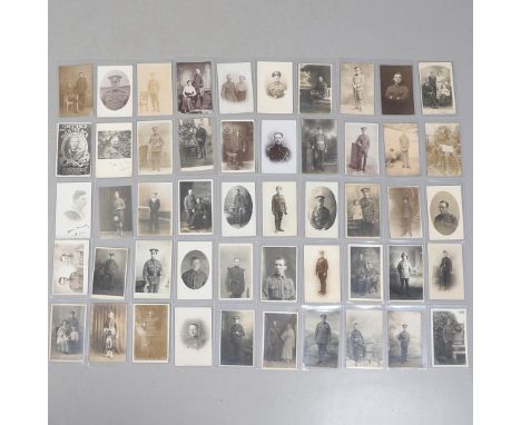 A COLLECTION OF FIFTY POSTCARDS OF FIRST WORLD WAR AND LATER SOLDIERS IN UNIFORM. An interesting collection of fifty postcard