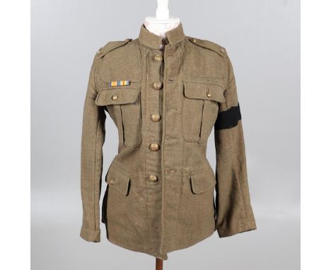 A FIRST WORLD WAR OTHER RANKS SERVICE DRESS TUNIC, 1902 PATTERN. A 1902 Pattern jacket with double pleat below the collar, pl