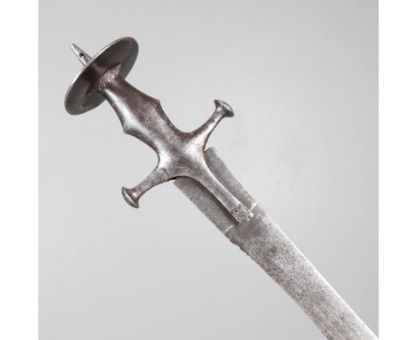 AN INDIAN TULWAR TYPE SWORD. With a 77 cm curved, pointed and sharpened blade, with a cruciform cross piece and circular pomm