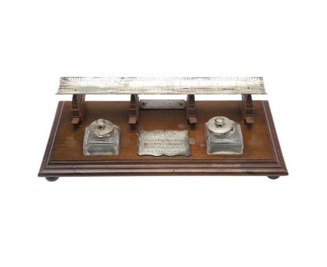 AN HISTORIC PRESENTATION DESK STAND FOR THE LAYING DOWN OF DREADNAUGHT BATTLESHIP H.M.S. KING GEORGE V BY LADY CURZON-HOWE. A