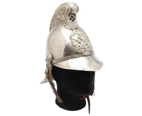 A LATE 19TH OR EARLY 20TH CENTURY MERRYWEATHER FIRE BRIGADE OFFICER'S HELMET. With a raised comb decorated with a fire-breath
