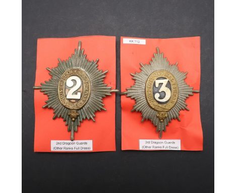 HELMET PLATES FOR THE SECOND AND THIRD DRAGOON GUARDS. A 2nd Dragoon Guards (Queen's Bays) helmet plate 1871-1914, with two t
