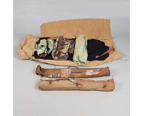 A COLLECTION OF MILTARY EQUIPMENT TO INCLUDE A FIRST WORLD WAR CAMP BED AND LATER EQUIPMENT ROLL. A Canvas and leather trimme