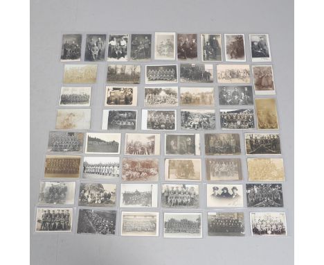 A COLLECTION OF FIFTY POSTCARDS OF FIRST WORLD WAR AND LATER GROUPS OF SOLDIERS IN UNIFORM. An interesting collection of fift