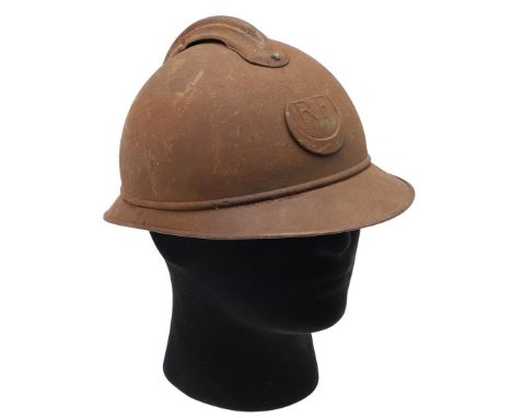 A FIRST WORLD WAR FRENCH ADRIAN HELMET. An M15 pattern Adrian Helmet with RF badge to the front for French colonial troops. I