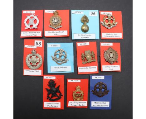 A COLLECTION OF ELEVEN BADGES FOR THE CITY OF LONDON AND MIDDLESEX REGIMENTS. A collection of badges including examples for W