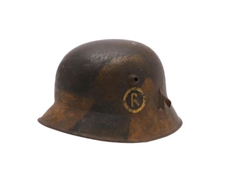 A GERMAN MANUFACTURED TURKISH M1918 STEEL HELMET. The helmet with twin lugs and folded rim, the front slightly higher than on
