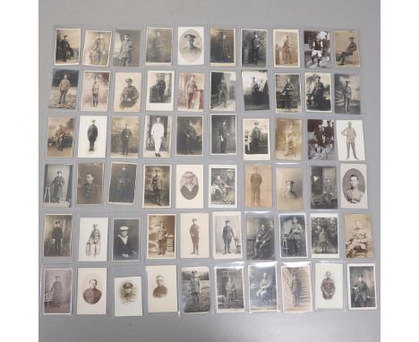 A COLLECTION OF SIXTY POSTCARDS OF FIRST WORLD WAR AND LATER SOLDIERS IN UNIFORM. An interesting collection of sixty postcard