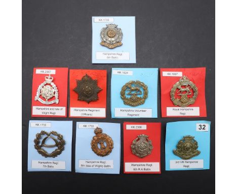 A COLLECTION OF NINE BADGES FOR THE HAMPSHIRE REGIMENT. A collection of badges for the Hampshire Regiment including badges fo