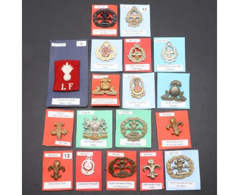 A COLLECTION OF EIGHTEEN BADGES FOR THE SOUTH LANCASHIRE AND MANCHESTER REGIMENTS. A collection of badges for the Manchester 