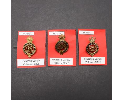 A COLLECTION OF THREE HOUSEHOLD CAVALRY FORAGE CAP BADGES. Three similar badges for George V. George VI and Elizabeth II. The