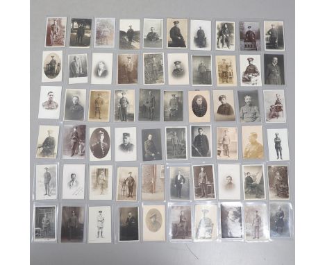 A COLLECTION OF SIXTY POSTCARDS OF FIRST WORLD WAR AND LATER SOLDIERS IN UNIFORM. An interesting collection of sixty postcard