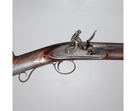 AN EARLY FLINTLOCK LONG GUN 'COMPANY PROOF'. With an 85 cm barrel tapering from octagonal to circular, approximately 16 mm at