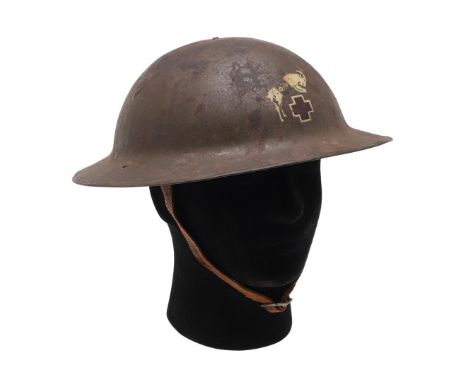 A FIRST WORLD WAR MK 1. BRODIE HELMET WITH US ARMY SIGNALS CORPS BADGE. A Steel Helmet with reinforced rim, painted in dark g