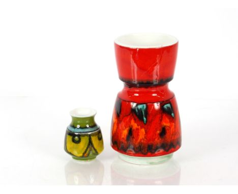 A Poole pottery "Dephis" vase, 24cm high AF; and a small Poole pottery green and yellow stylised floral decorated baluster po