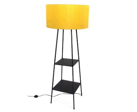 A modern design black metal standard lamp with two tier base and green shade 