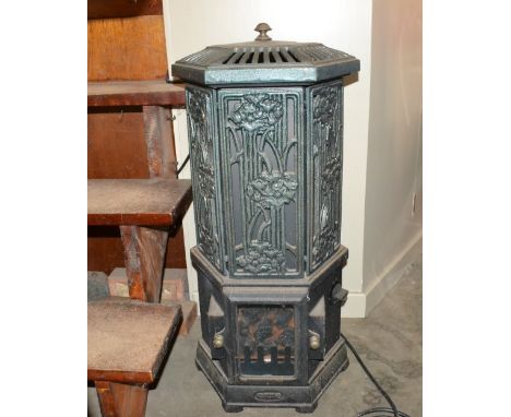 A French design cast iron and painted electric heater 74cm high - (sold as a collector's item)