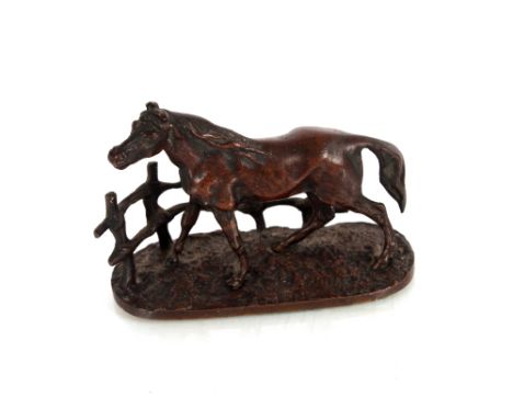 After P.J. Mené, a small bronze study of a horse standing in front of a fence, 9cm long