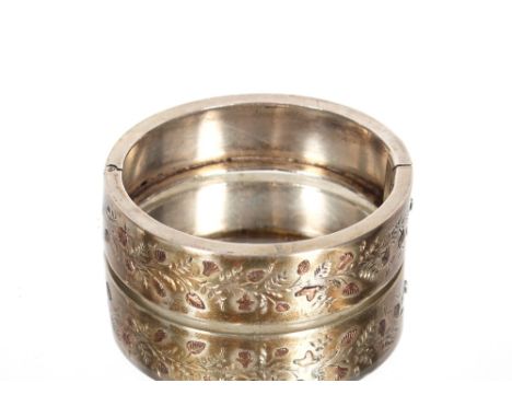 A silver and yellow metal inlaid snap bangle approx. 26gms 