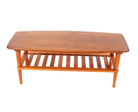 A 1970's light wood oblong coffee table with magazine rack under, 104cm x 45cm 