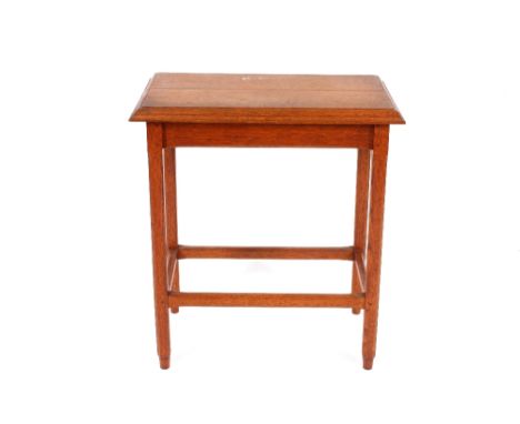 A light oak occasional table, the rectangular top raised on square chamfered supports united by stretchers, 62cm x 34cm