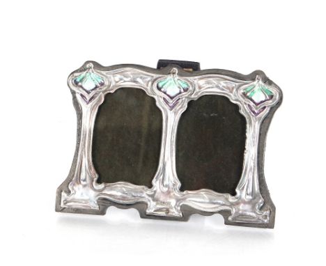 A small silver and enamel decorated double photograph frame 