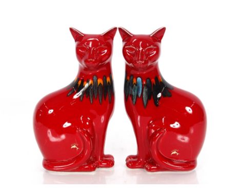 A pair of Poole pottery red glazed seated cat ornaments, 29cm high 