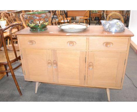 A light Ercol sideboard fitted two drawers and cupboards below raised on rounded tapering supports, 120cm wide x 47cm deep, 8