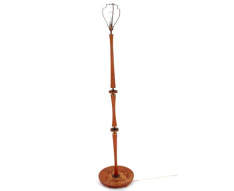 A 1960's teak standard lamp and shade