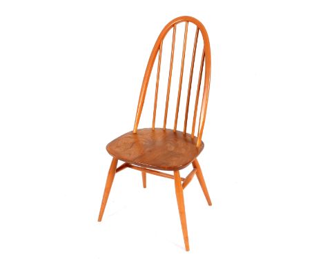 A set of four Ercol stick back dining chairs 