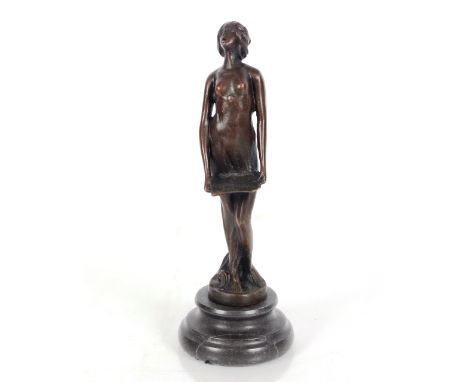 A bronze figure of a naked girl carrying a tray, raised on marble plinth, 20cm high 